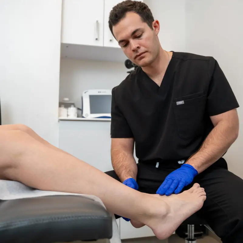 Dr. Shaun Cole performing a leg ultrasound evaluation on a patient at Vein treatments NY in Astoria, New York.