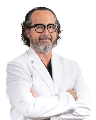 Professional portrait of Dr. Walter Lech, a vein specialist, wearing a white lab coat and glasses, posed against a black background with arms crossed. This formal clinical headshot represents a healthcare provider specializing in vein treatment services.